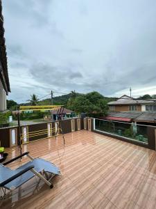 a deck with a gym on top of a building at nd homestay in Kuala Lipis