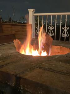 a fire is burning in the street at night at AEROPUERTO-Rionegro- MONTEOLIVO COLONIAL in Rionegro