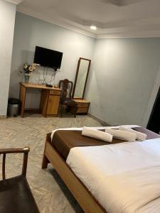 Кровать или кровати в номере Hotel Baga Empire