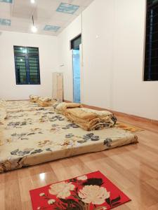 Posteľ alebo postele v izbe v ubytovaní Homestay Nắng Nghiêng