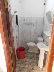 a bathroom with a toilet and a sink at Tom's Place in Siem Reap