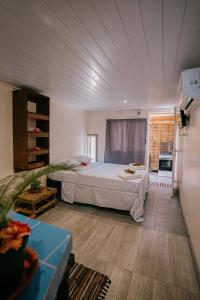 a bedroom with a large bed in a room at Mianahere Studio Bora Bora in Bora Bora