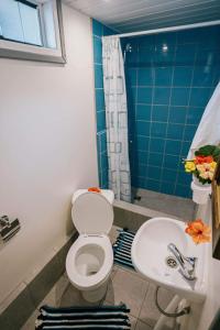 a bathroom with a toilet and a sink at Mianahere Studio Bora Bora in Bora Bora