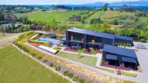 an aerial view of a house with a garden at Harakeke Boutique Accommodation in Mahana