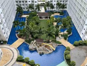 an aerial view of the pool at the resort at MOA Pasay 1156 Shore Residences Hotel Vibe Staycation in Manila