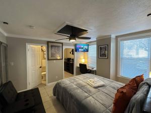 a bedroom with a bed and a ceiling fan at Maiden Nest Private Master Suite in Pawtucket