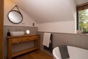 a bathroom with a sink and a mirror at Beautiful Luxury one bedroom retreat in Far Sawrey in Far Sawrey