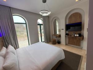 Postel nebo postele na pokoji v ubytování Dibba Mountain Park Resort + 37 fotografií