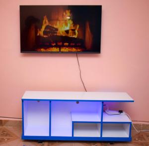 a blue and white table in front of a fireplace at Furnished one bedroom bnb in thika town, jomoko in Thika