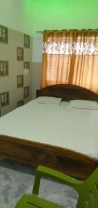Ein Bett oder Betten in einem Zimmer der Unterkunft Hotel Sonali