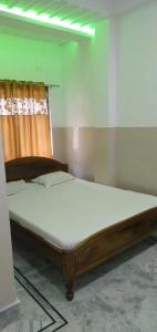 Un ou plusieurs lits dans un hébergement de l'établissement Hotel Sonali