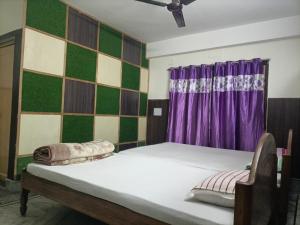 Un ou plusieurs lits dans un hébergement de l'établissement Hotel Sonali