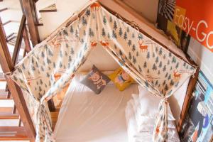 Voodi või voodid majutusasutuse Yoho Beach Resort Kenting toas