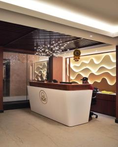 a lobby with a reception desk in a building at Hotel Sonar Bangla Puri in Puri