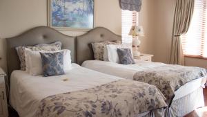 Кровать или кровати в номере Candlewoods Guesthouse
