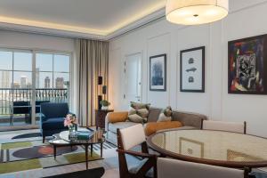 a living room with a couch and a table at The Westin Dubai Mina Seyahi Beach Resort and Waterpark in Dubai