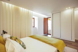 Postel nebo postele na pokoji v ubytování RB Ganfei House + 25 fotografií