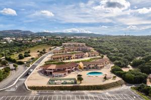 an aerial view of a resort with a pool at ISA-Residence with swimming-pool in Isola Rossa, apartments with air conditioning and private outdoor area in Isola Rossa