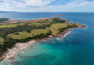 an aerial view of an island in the ocean at ISA-Residence with swimming-pool in Isola Rossa, apartments with air conditioning and private outdoor area in Isola Rossa +10 photos