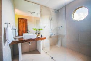 a bathroom with a sink and a shower at Kandy Casa by Regus in Kandy