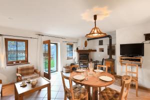 a living room with a table and a dining room at Rustico Alla Bolla - Happy Rentals in Frasco