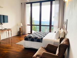 Postel nebo postele na pokoji v ubytování Kandy Casa by Regus