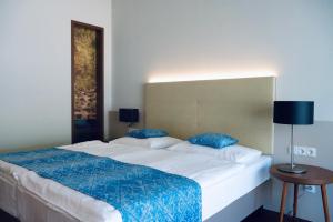 Nuhr Medical - Hotel & Restaurant客房内的一张或多张床位