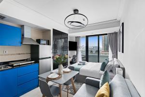 a living room with a couch and a table at StoneTree - New Studio in JLT in Dubai