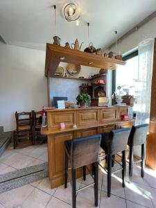 a dining room with a wooden table and chairs at Da Teresa in Bardineto