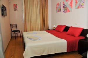 Ένα ή περισσότερα κρεβάτια σε δωμάτιο στο Alma-Ata Hotel