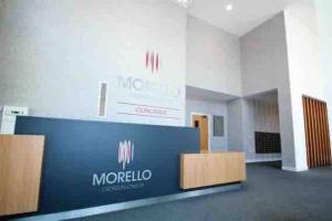 a lobby with a sign for a mtoroglio building at Luxury 2 bed ensuite 2 bathroom apartment East Croydon in South Norwood