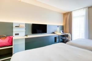 Postel nebo postele na pokoji v ubytování Green Park Hotel Brugge