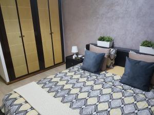 a bedroom with a bed and two pillows at Beautiful Apartment Holiday with Terrace, Casablanca in Casablanca