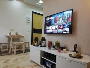 a flat screen tv on a wall in a room at Beautiful Apartment Holiday with Terrace, Casablanca in Casablanca