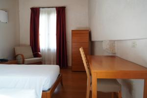 Postel nebo postele na pokoji v ubytování Campus San Francesco