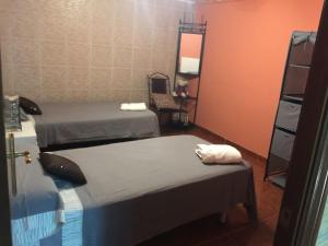 Un pat sau paturi într-o cameră la Sitges Llum House