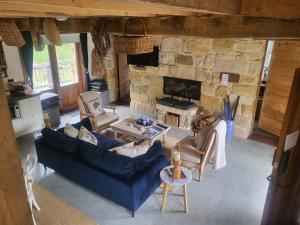 an overhead view of a living room with a stone fireplace at The Cottage Burradoo in Burradoo