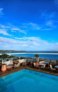 a swimming pool on the deck of a hotel at Dar El Marsa Hotel & Spa in La Marsa