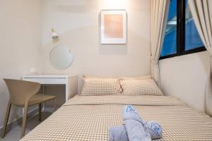 Postel nebo postele na pokoji v ubytování Majestic Maxim Amazing Homestay by Feel Home Malaysia