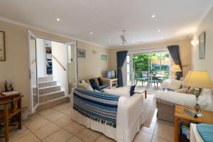 a living room with a couch and a table at Dunwerkin Self Catering in Kenton on Sea