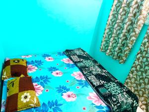a close up of a bag with flowers on it at Shri Gamya Guest House in Ujjain +3 photos