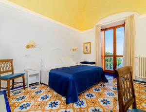 Postel nebo postele na pokoji v ubytování Hotel La Bussola