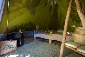 Łóżko lub łóżka w pokoju w obiekcie Camping U Pirellu