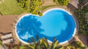 Vue sur la piscine de l'établissement Casa das Bromélias by LovelyStay ou sur une piscine à proximité