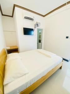 Giường trong phòng chung tại Hotel Aloha 2