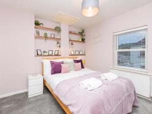 a bedroom with two beds and a window at Pass the Keys Delightful retreat in Larkhall with free parking in Bath