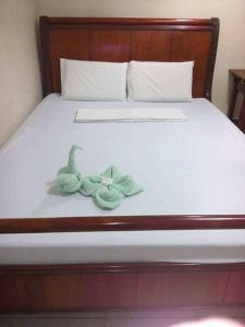 מיטה או מיטות בחדר ב-Goland Pension House & Dormitory by SMS Hospitality