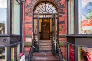 an entrance to a brick building with a door at Boston Studio on Newbury w A shopping dining BOS-600 in Boston