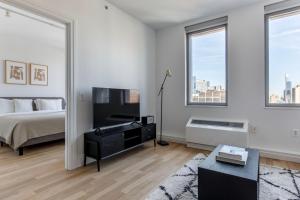 A television and/or entertainment centre at Midtown West 1br w gym laundry nr park NYC-1311