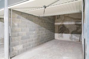 an empty garage with a brick wall at Large terrace, sea view, 5mn Monaco, free parking in Beausoleil